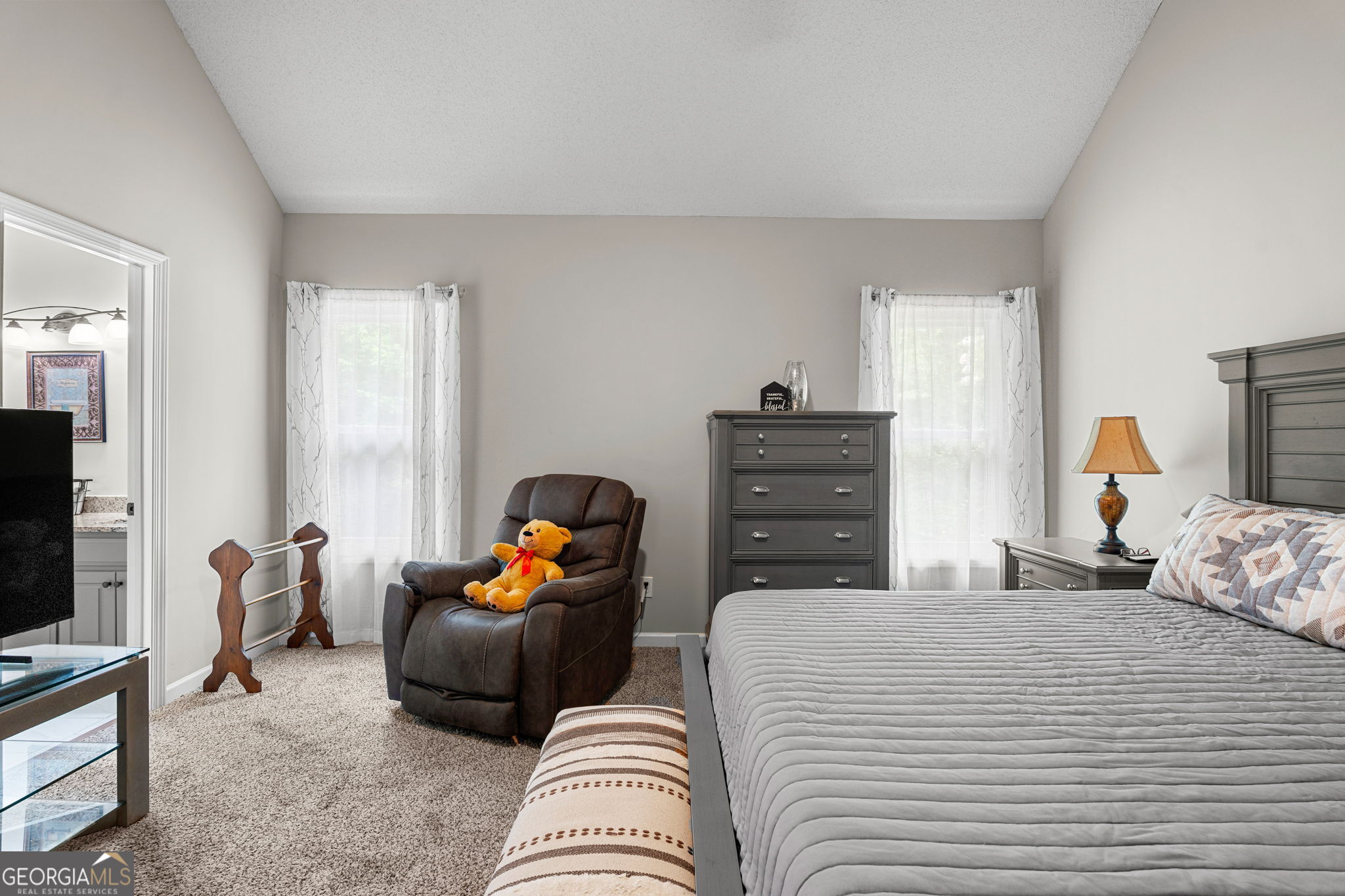 375 Gaelic Way Tyrone, GA 30290 - Photo 29 of 54 a bedroom with furniture and a flat screen tv