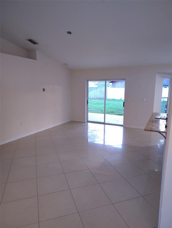 153 Rosedale Avenue Spring Hill, FL 34606 - Photo 6 of 16 a view of an empty room with a window