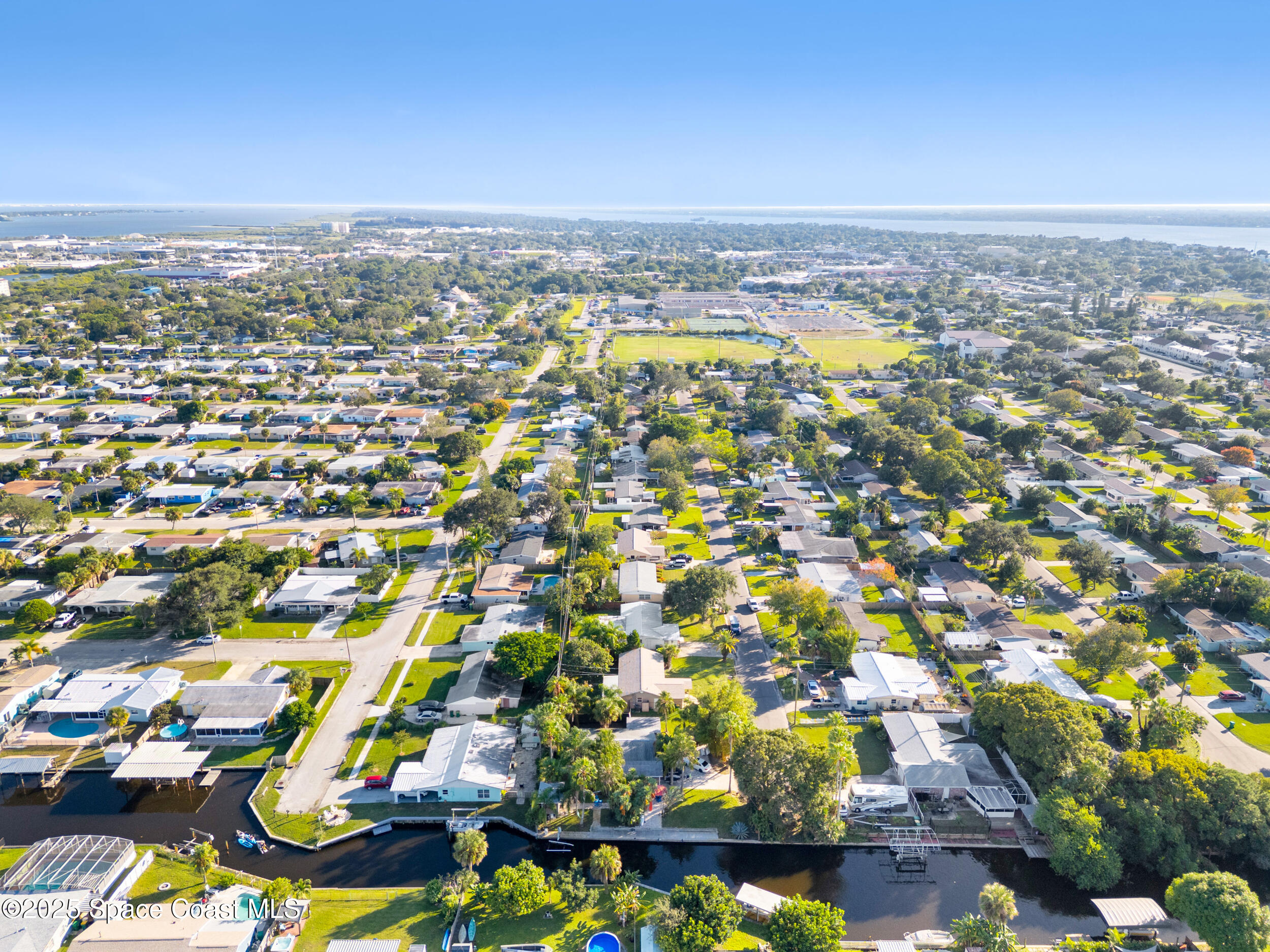 322 3rd Street Merritt Island, FL 32953 - Photo 14 of 38 an aerial view of residential houses with outdoor space
