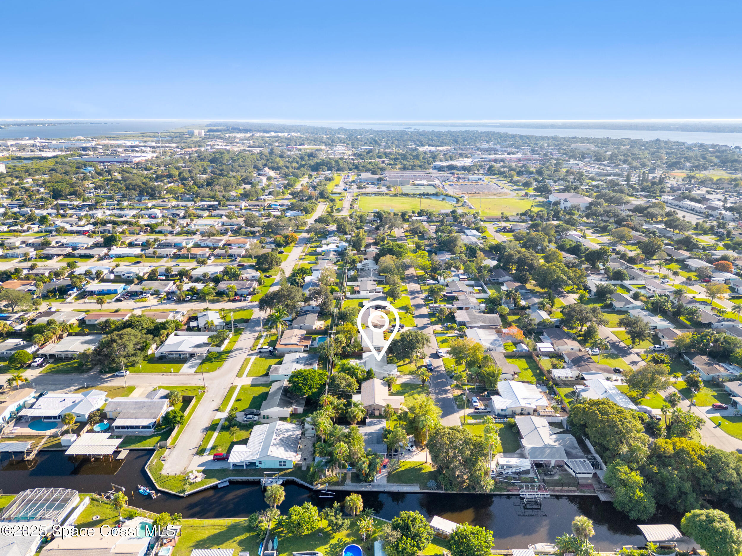 322 3rd Street Merritt Island, FL 32953 - Photo 15 of 38 an aerial view of residential houses with outdoor space