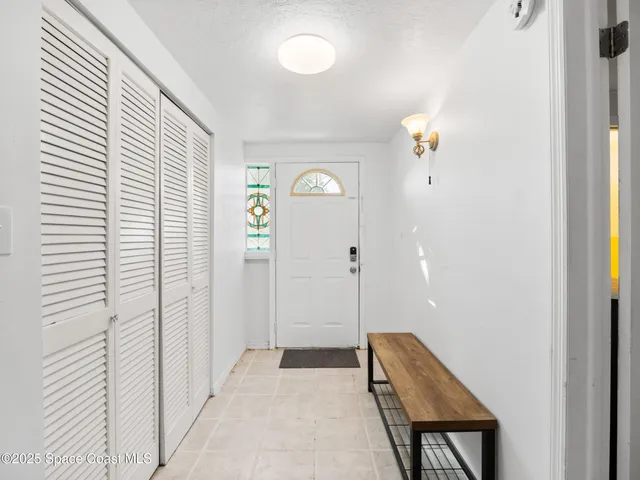a view of room with window and wooden floor