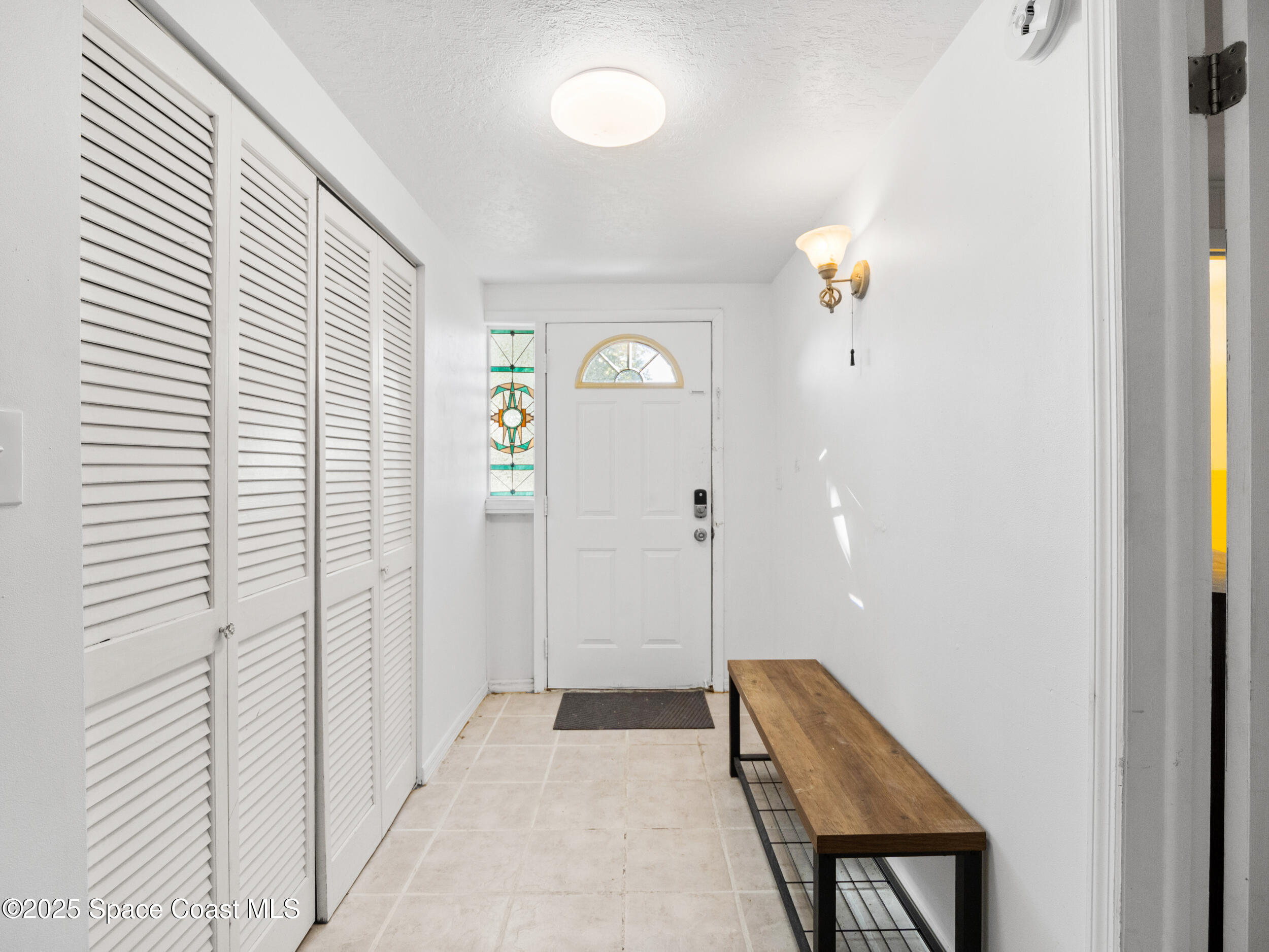 322 3rd Street Merritt Island, FL 32953 - Photo 16 of 38 a view of room with window and wooden floor