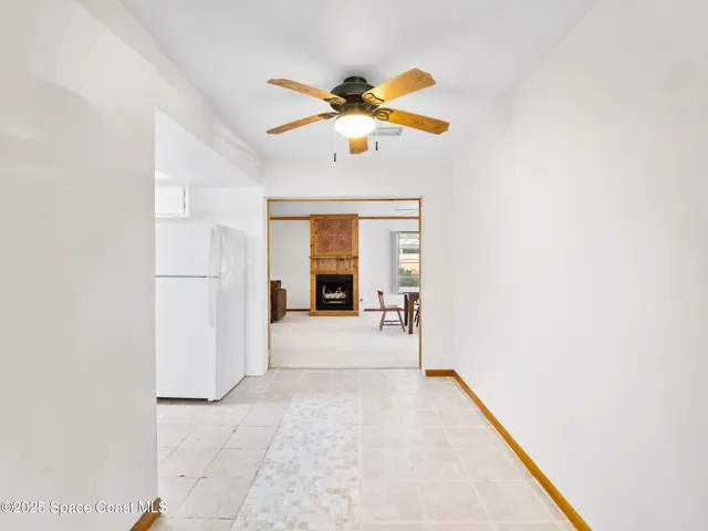 a view of livingroom with hardwood floor and ceiling fan