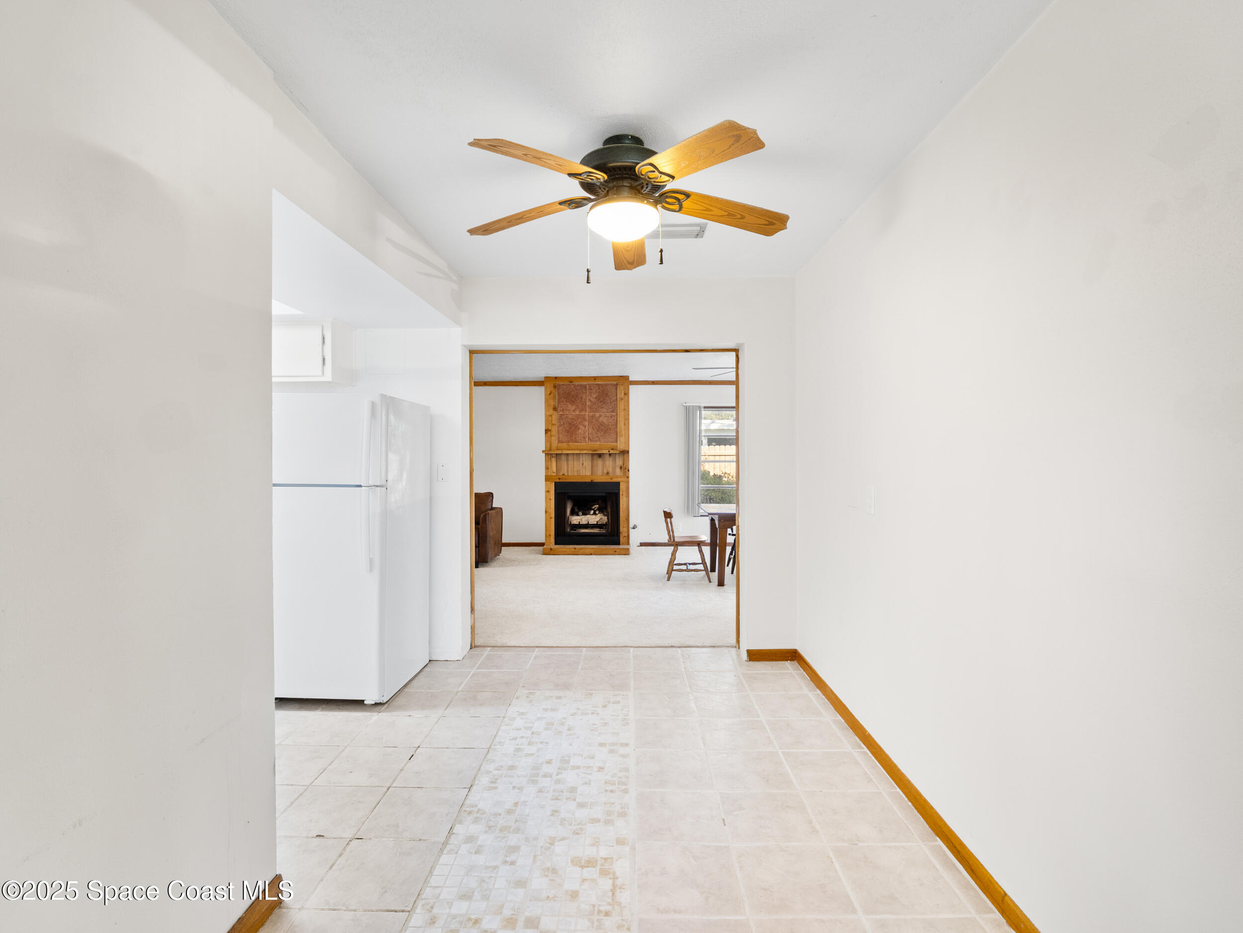 322 3rd Street Merritt Island, FL 32953 - Photo 17 of 38 a view of livingroom with hardwood floor and ceiling fan