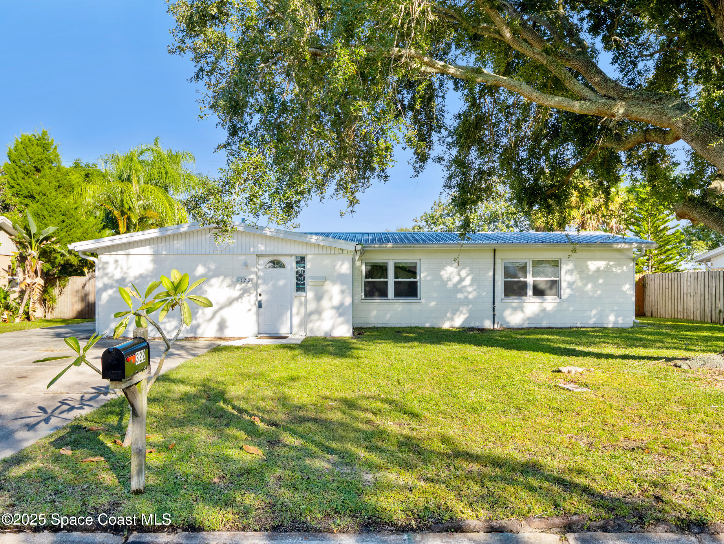 322 3rd Street Merritt Island, FL 32953 - Photo 2 of 38 a view of a house with swimming pool