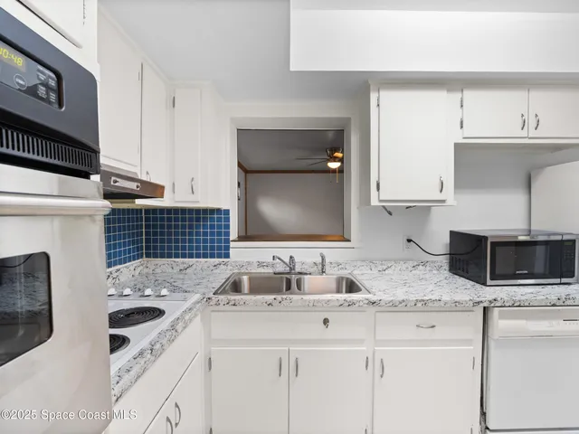 a bathroom with a sink and a washing machine