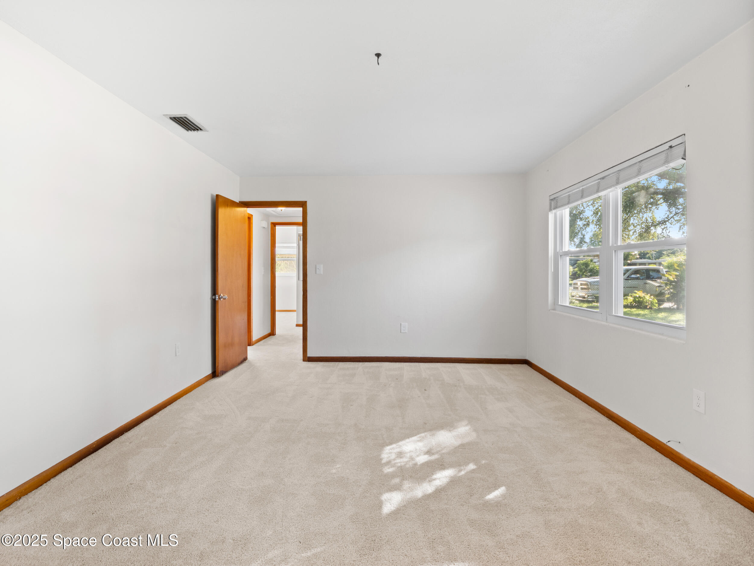 322 3rd Street Merritt Island, FL 32953 - Photo 29 of 38 a view of an empty room with a window
