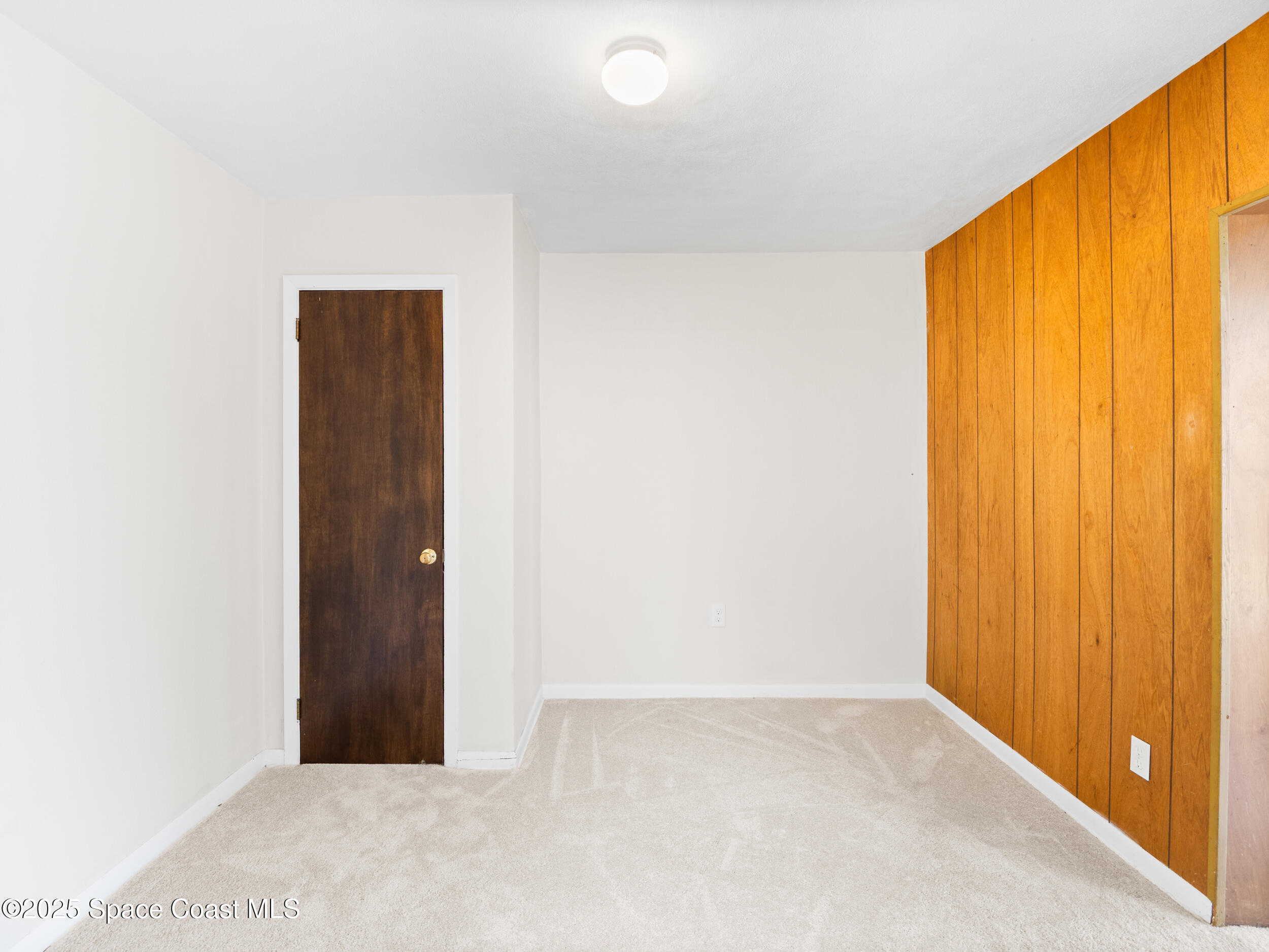 322 3rd Street Merritt Island, FL 32953 - Photo 31 of 38 an empty room with windows