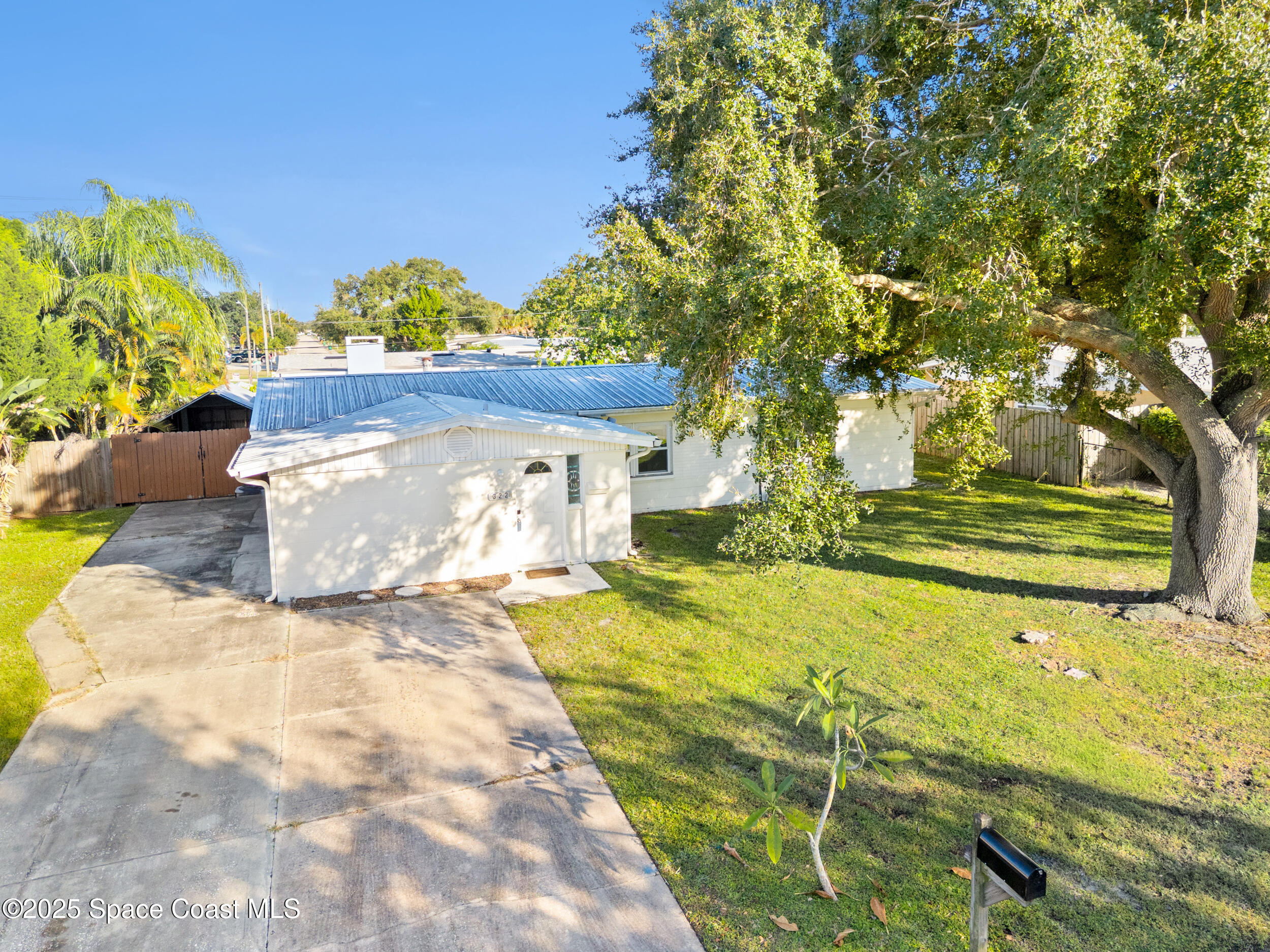 322 3rd Street Merritt Island, FL 32953 - Photo 7 of 38 a view of a fountain in the backyard of a house