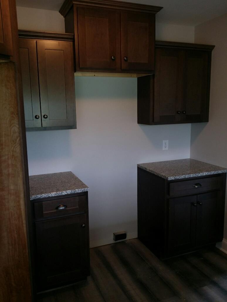 558 Corinth Road Portland, TN 37148 - Photo 5 of 10 a kitchen with granite countertop stainless steel appliances and cabinets