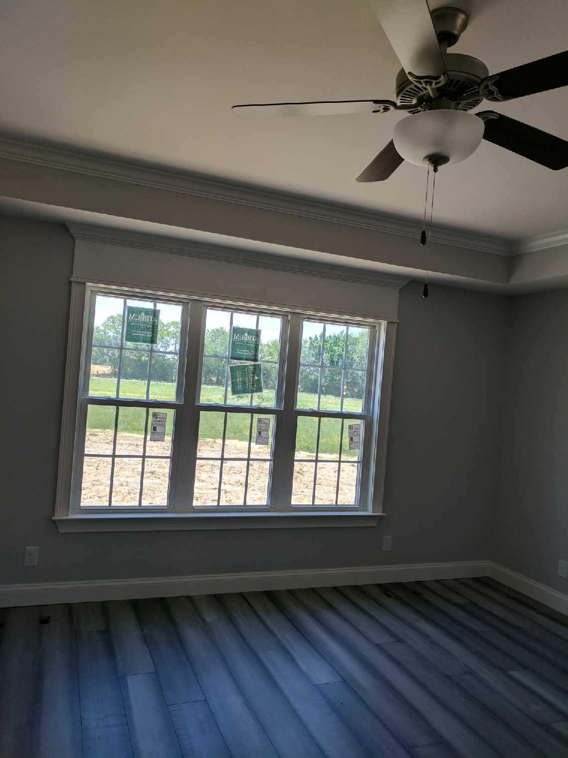 558 Corinth Road Portland, TN 37148 - Photo 7 of 10 a view of an empty room with a window and wooden floor