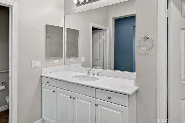 a bathroom with a tub a sink and a shower