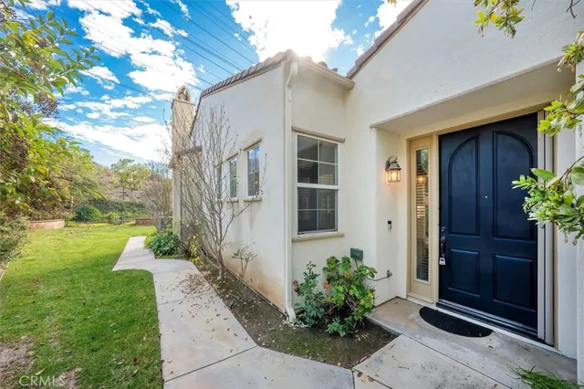 a kitchen with white cabinets and appliances