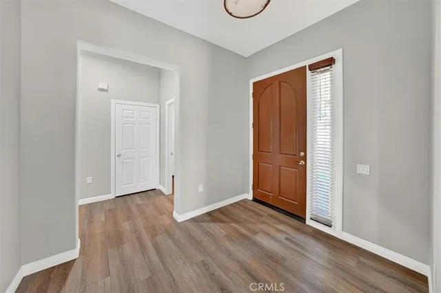 a room with a window and a wooden floor