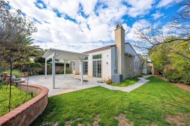 a view of a backyard with a large tree