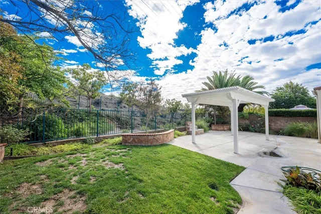 a front view of house with yard and outdoor seating