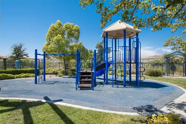 a view of a swimming pool with a garden and plants