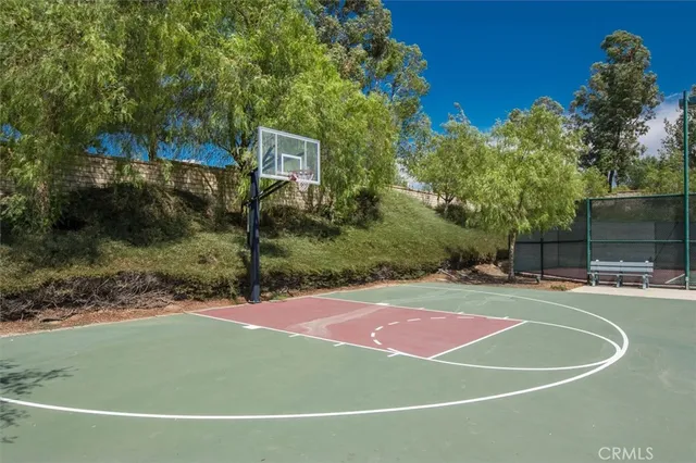 a bathroom with a sink a bathtub and a window