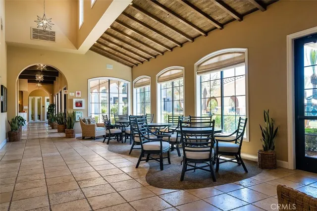 a room with a table chairs and a table