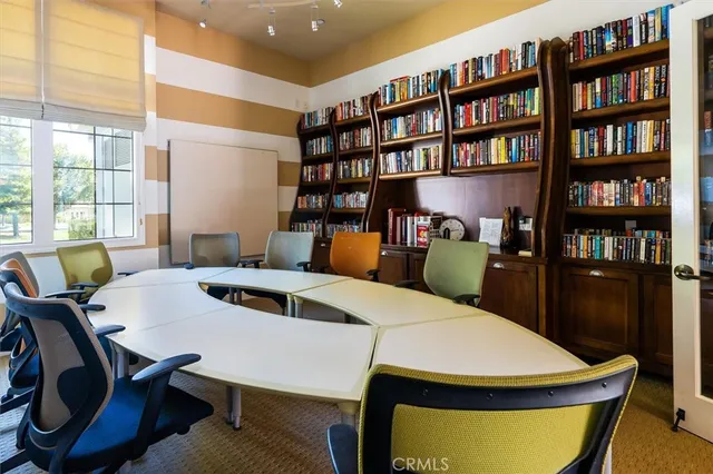 a view of hall way with furniture