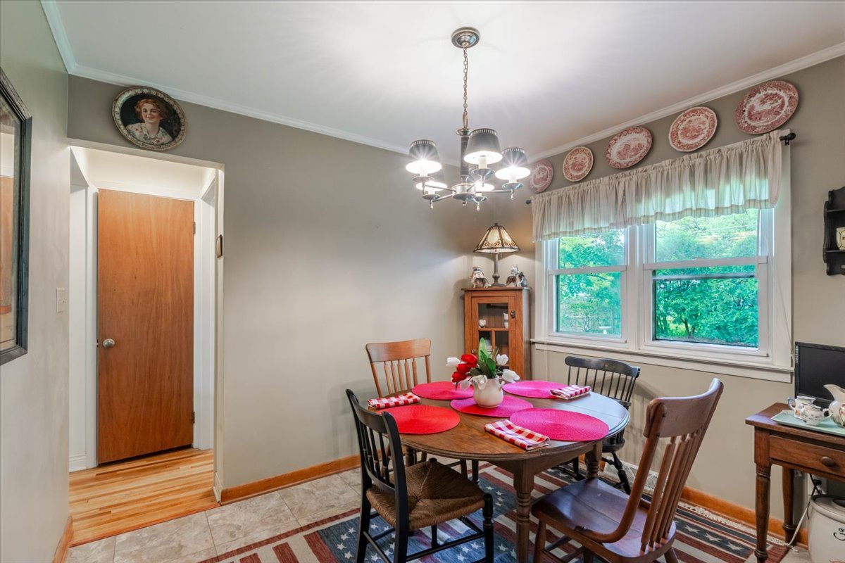 302 Radliff Road Bloomington, IL 61701 - Photo 10 of 35 a view of a dining room with furniture and window