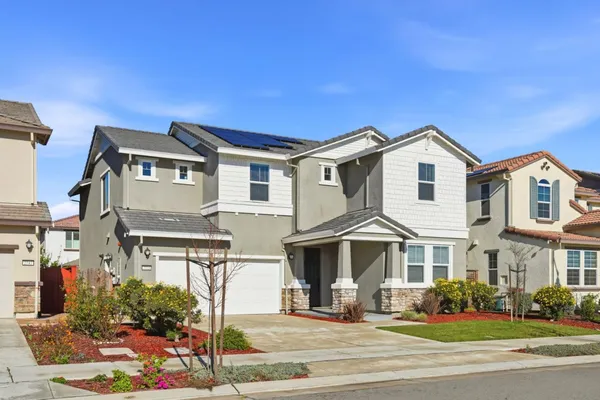 a front view of a residential houses with street