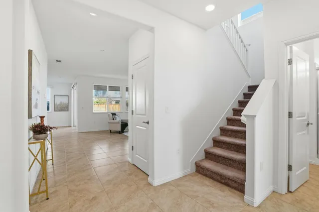 a view of entryway with livingroom and stairs