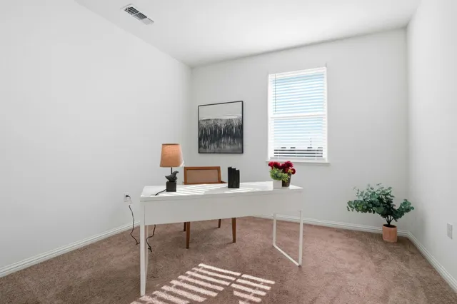 a room with furniture and window