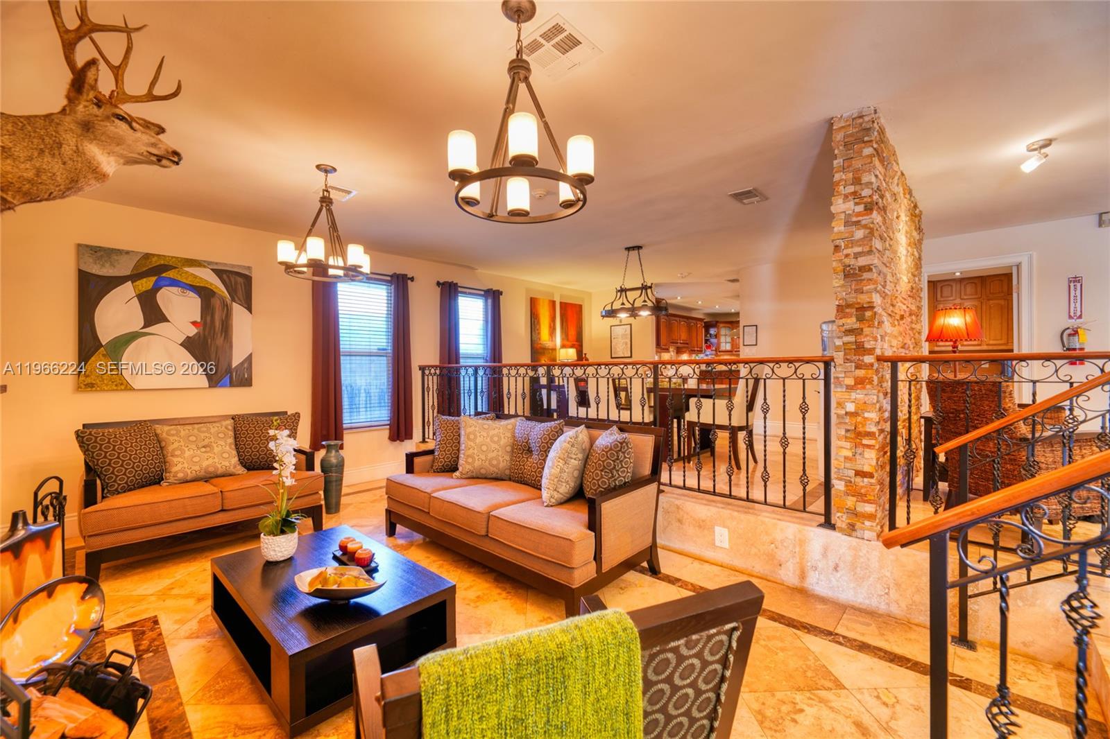 5826 Southwest 17th Street Miami, FL 33155 - Photo 13 of 46 a living room with furniture a rug and a chandelier
