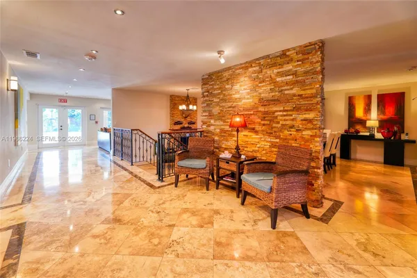 a view of a lobby with furniture and rug