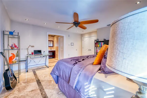 a bed room with a bed and a chair