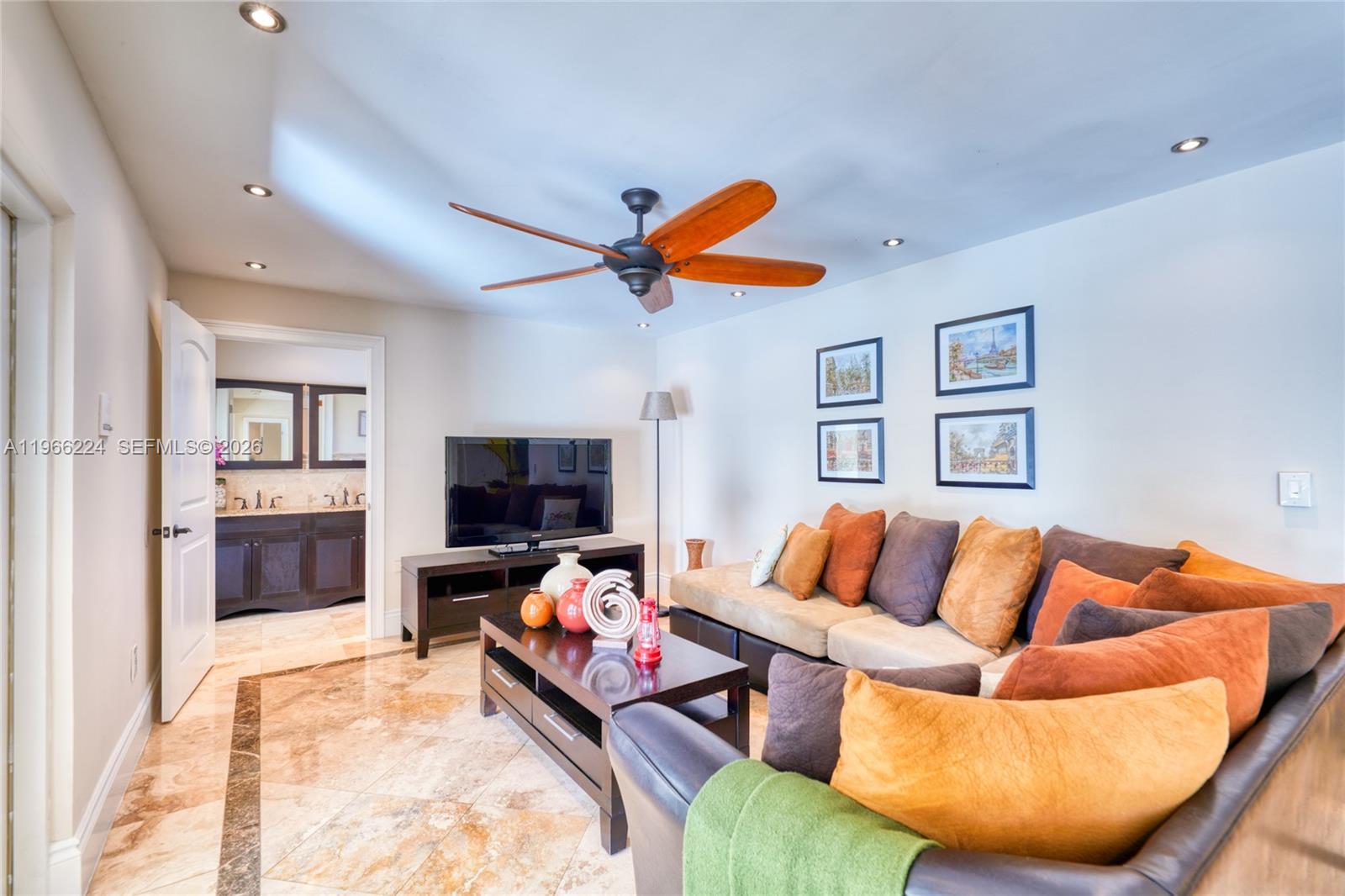 5826 Southwest 17th Street Miami, FL 33155 - Photo 30 of 46 a living room with furniture and a flat screen tv