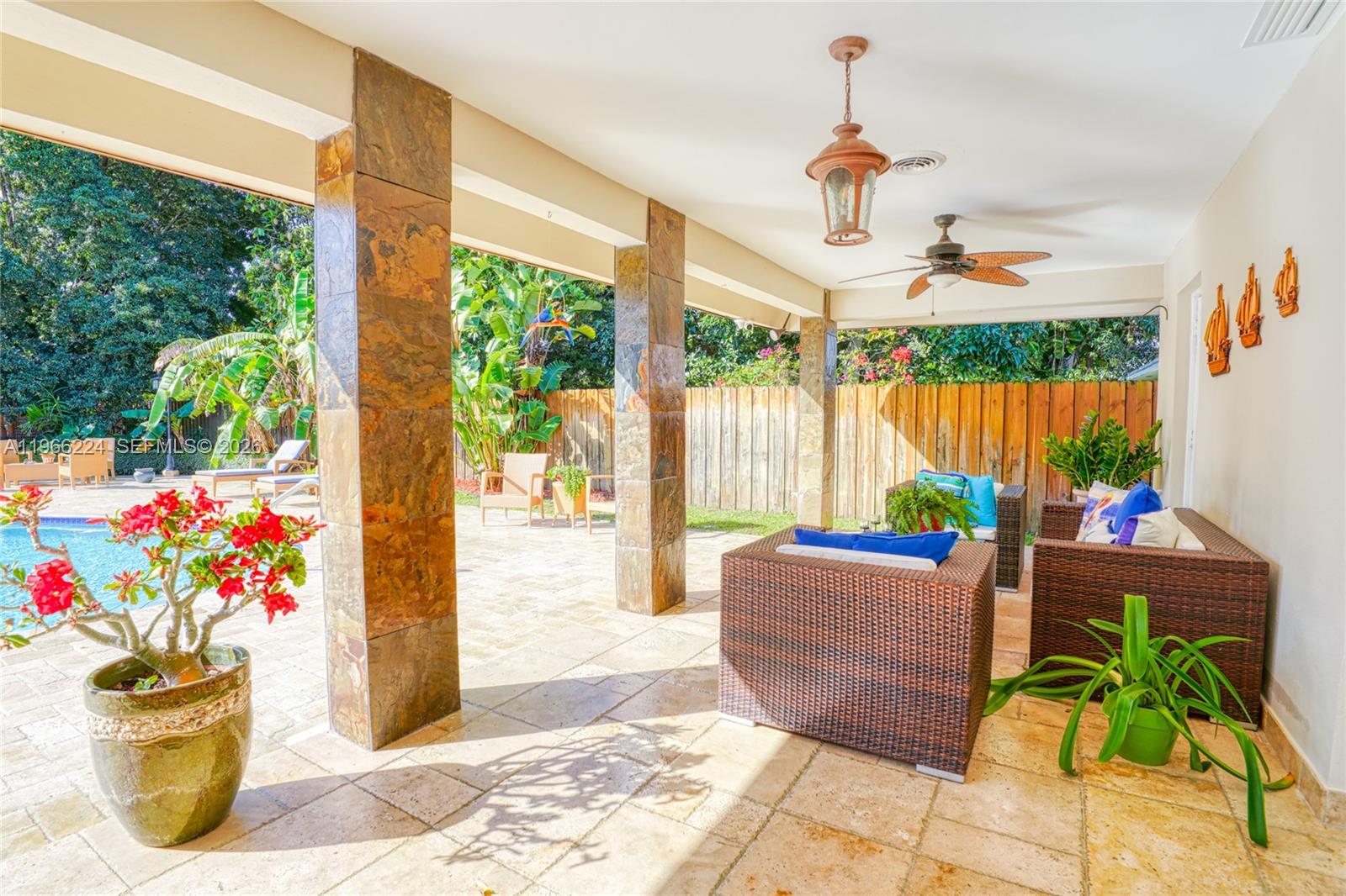 5826 Southwest 17th Street Miami, FL 33155 - Photo 35 of 46 a living room with furniture and a potted plant