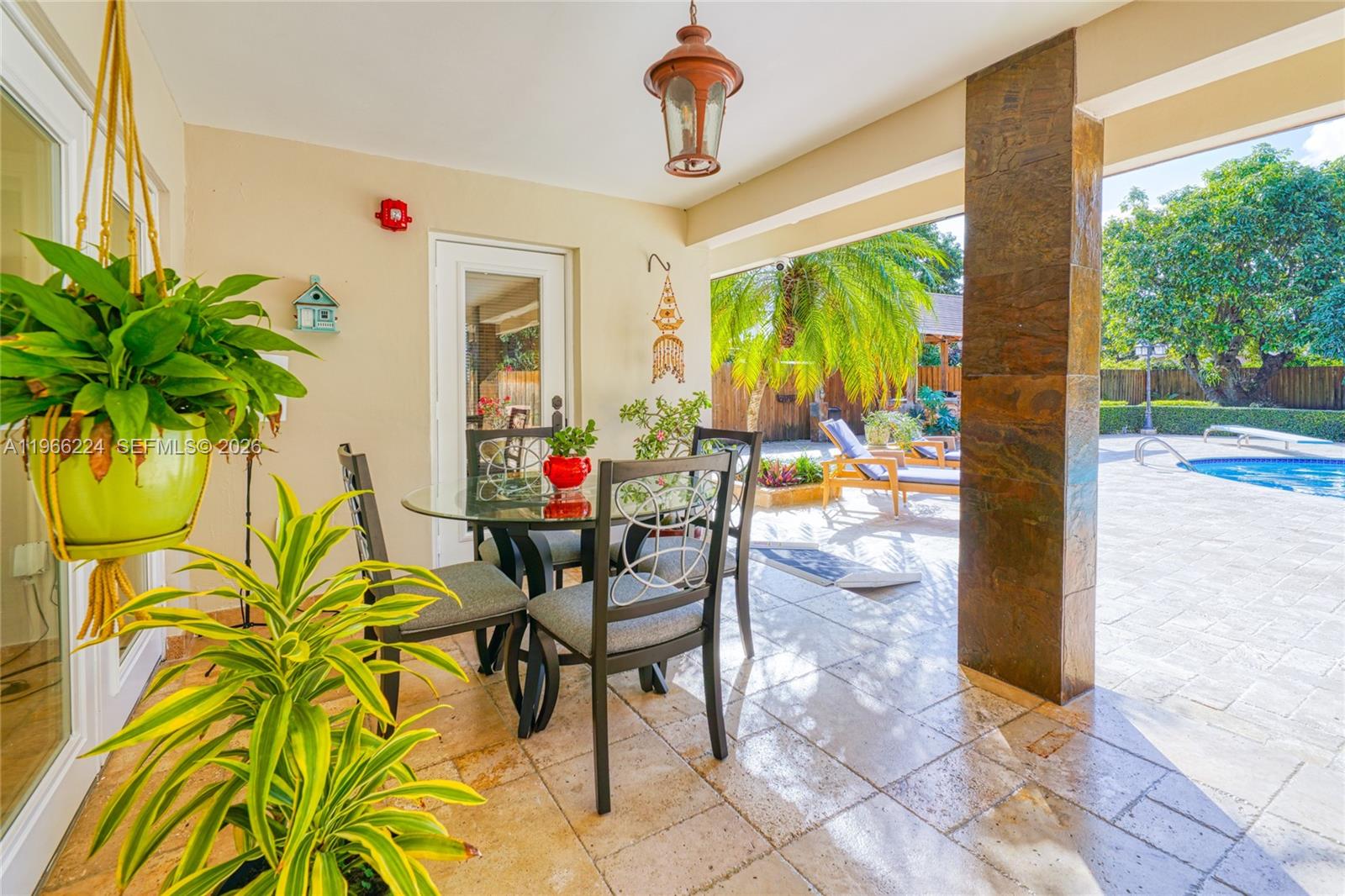 5826 Southwest 17th Street Miami, FL 33155 - Photo 36 of 46 a view of a porch with dining table and chairs