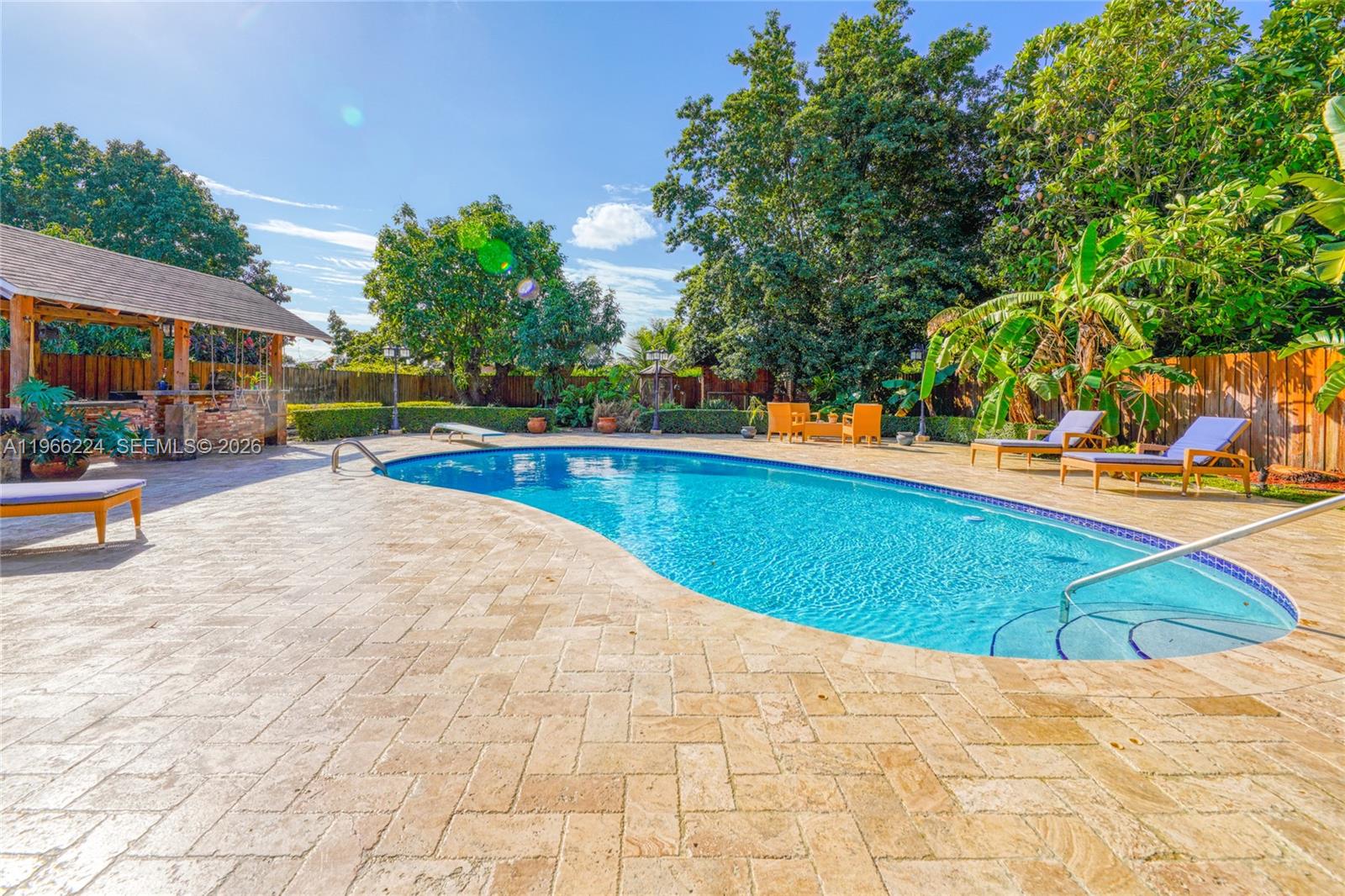 5826 Southwest 17th Street Miami, FL 33155 - Photo 37 of 46 a swimming pool with outdoor seating and yard