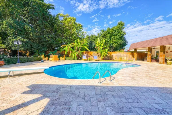 a view of a swimming pool with a patio