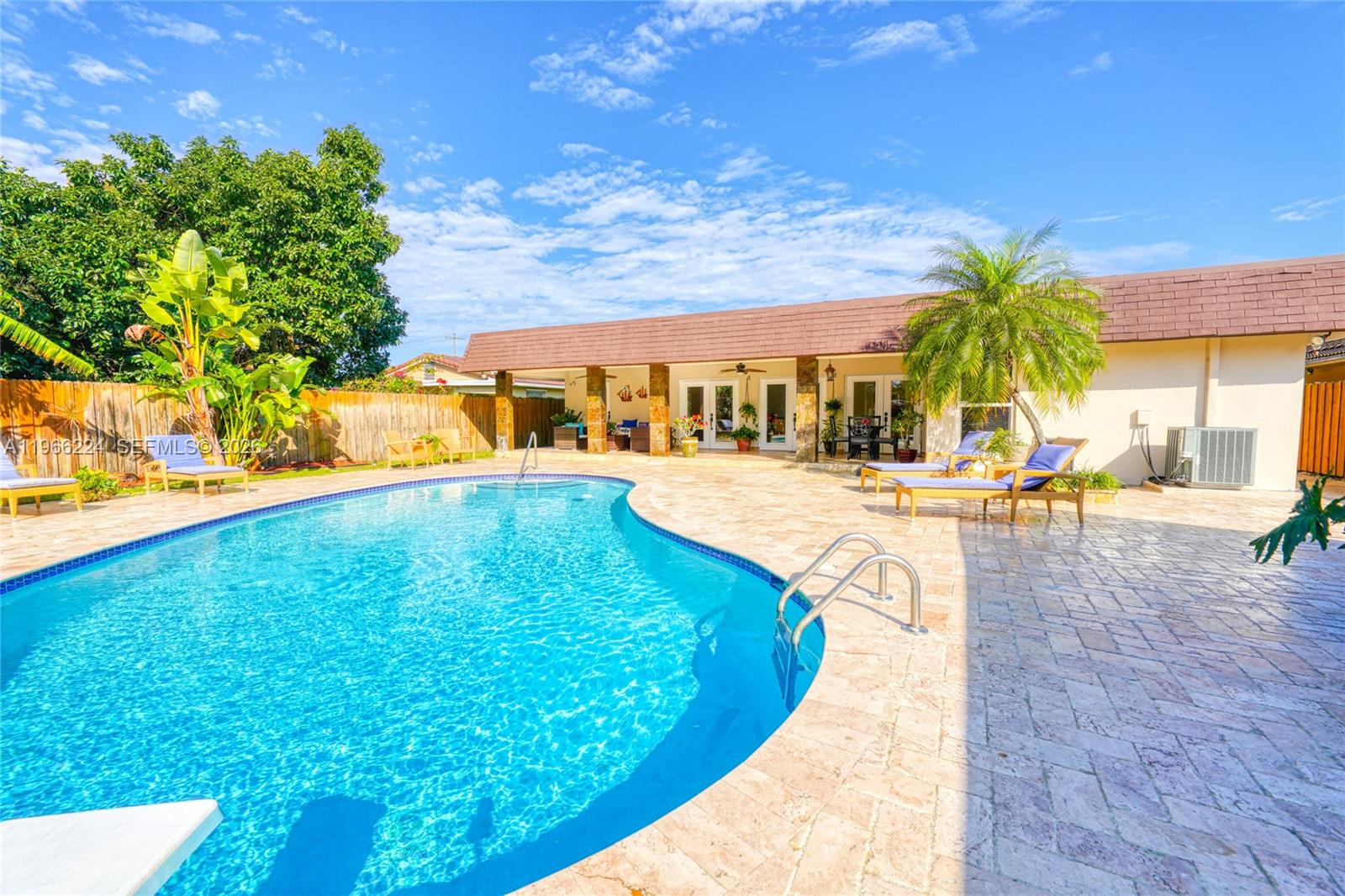 5826 Southwest 17th Street Miami, FL 33155 - Photo 39 of 46 a view of a swimming pool with an outdoor seating