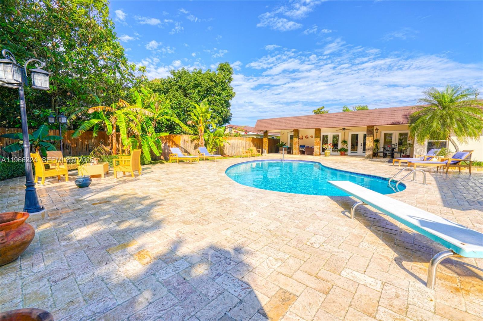 5826 Southwest 17th Street Miami, FL 33155 - Photo 40 of 46 a view of swimming pool with lawn chairs and plants