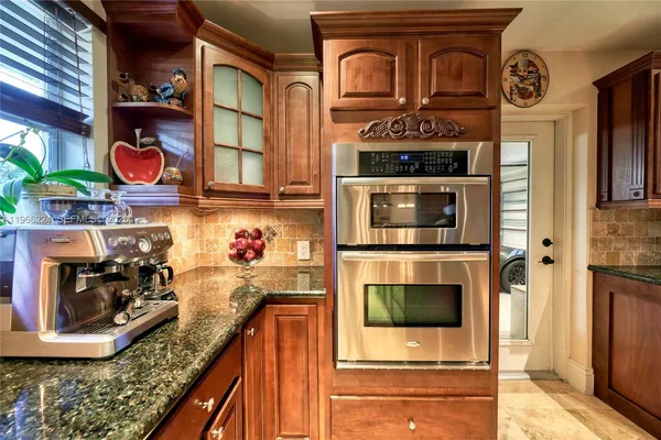 a kitchen with a stove and a microwave