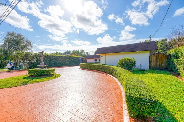 a view of a backyard with a garden