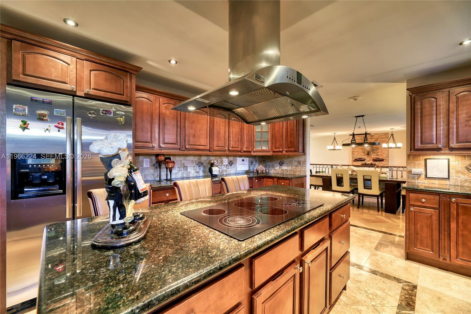 5826 Southwest 17th Street Miami, FL 33155 - Photo 7 of 46 a kitchen with stainless steel appliances granite countertop a sink counter space and cabinets