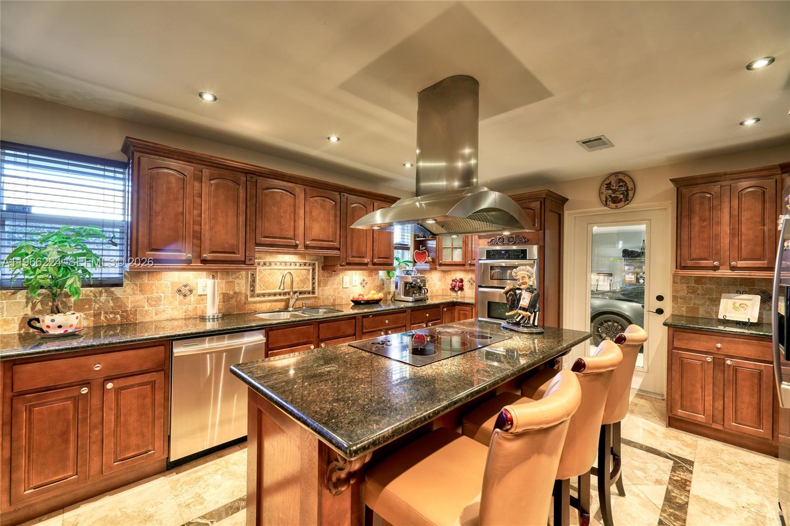 5826 Southwest 17th Street Miami, FL 33155 - Photo 8 of 46 a kitchen with a counter top space appliances and cabinets