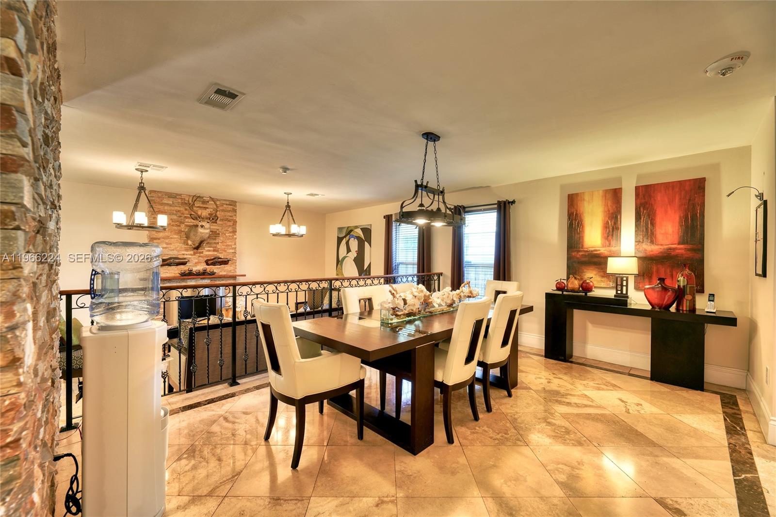 5826 Southwest 17th Street Miami, FL 33155 - Photo 10 of 46 a dining area with a table chairs and a kitchen view