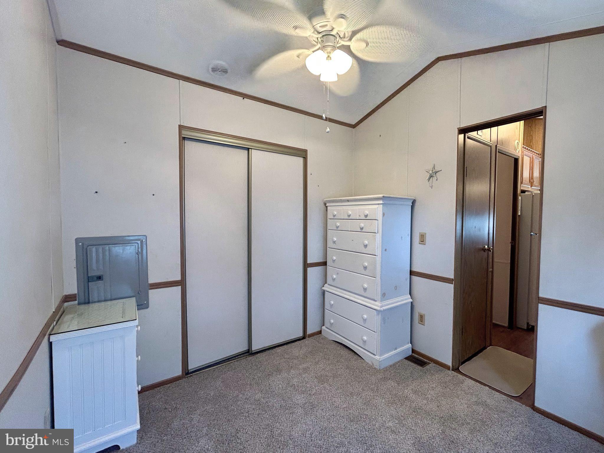 104 South 5th Avenue, Unit 39 Rio Grande, NJ 08242 - Photo 14 of 20 an empty room with chandelier fan and closet