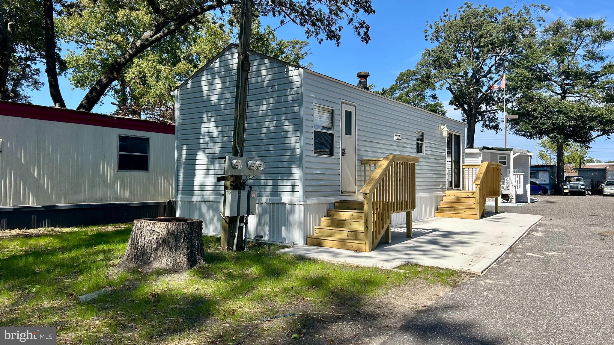 104 South 5th Avenue, Unit 39 Rio Grande, NJ 08242 - Photo 3 of 20 a view of a house with backyard and a tree
