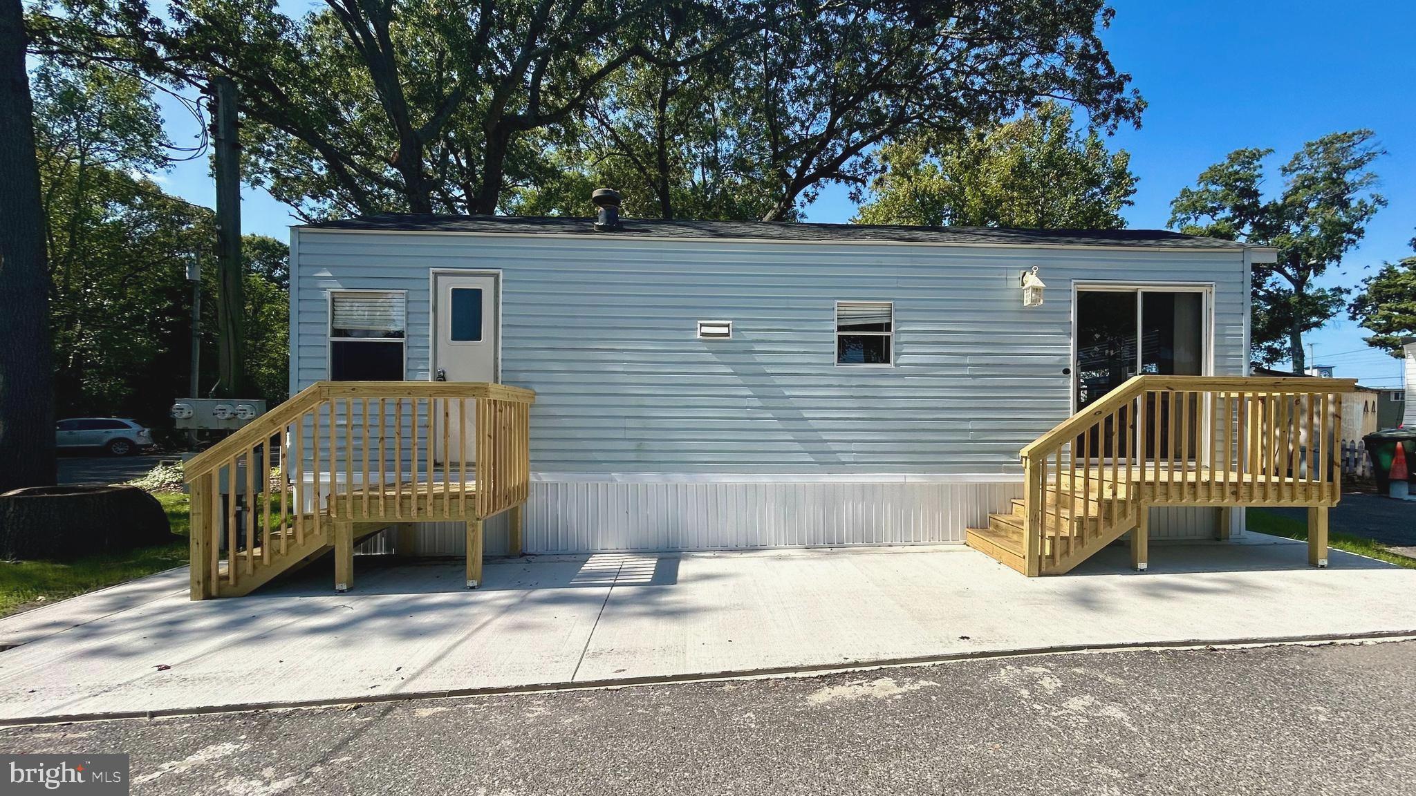 104 South 5th Avenue, Unit 39 Rio Grande, NJ 08242 - Photo 4 of 20 a front view of a house with a garden