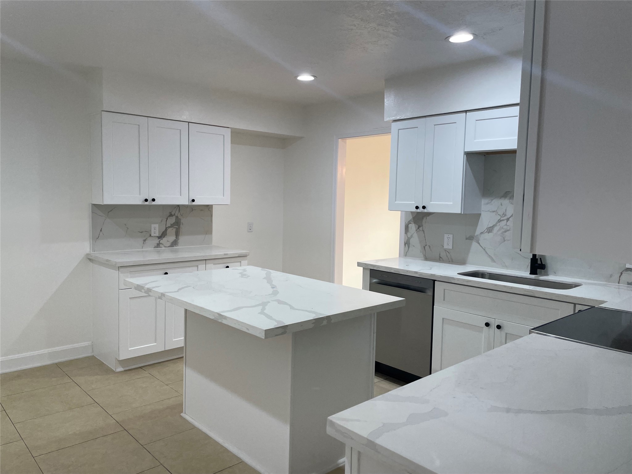 11630 Coachfield Lane Houston, TX 77035 - Photo 11 of 18 a kitchen with a sink stove and cabinets