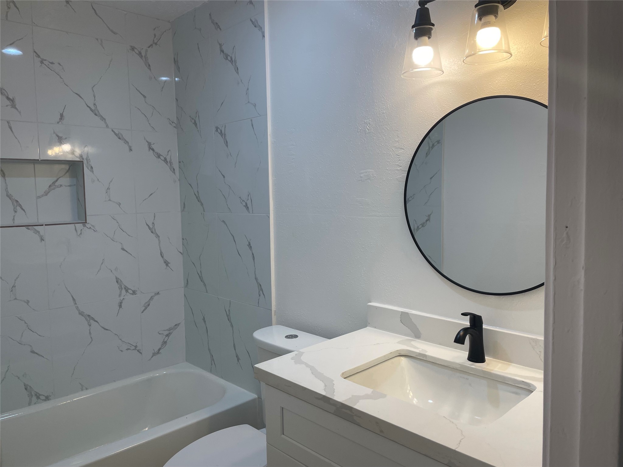 11630 Coachfield Lane Houston, TX 77035 - Photo 15 of 18 a bathroom with a sink and a mirror