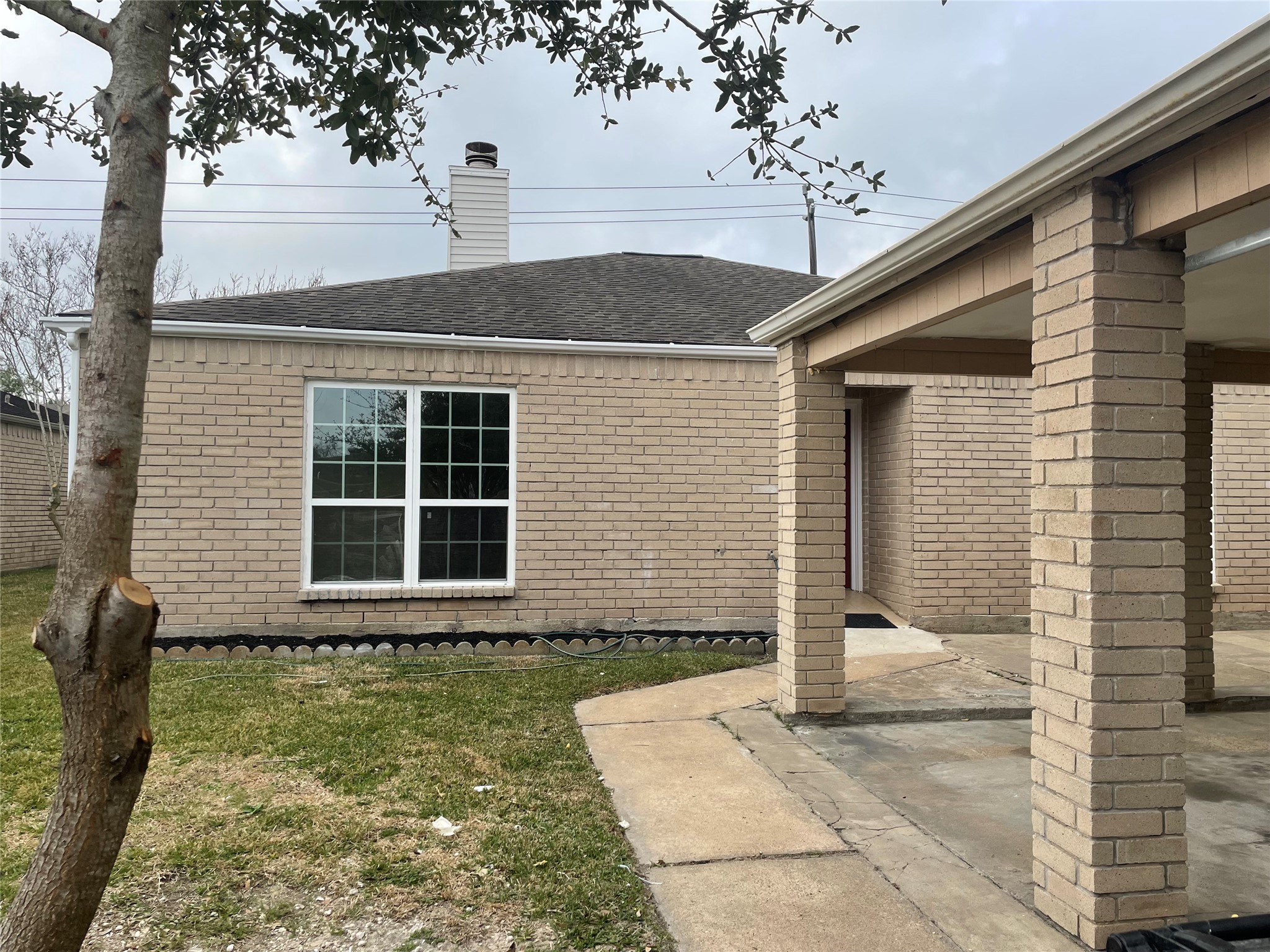 11630 Coachfield Lane Houston, TX 77035 - Photo 3 of 18 a front view of a house with a yard