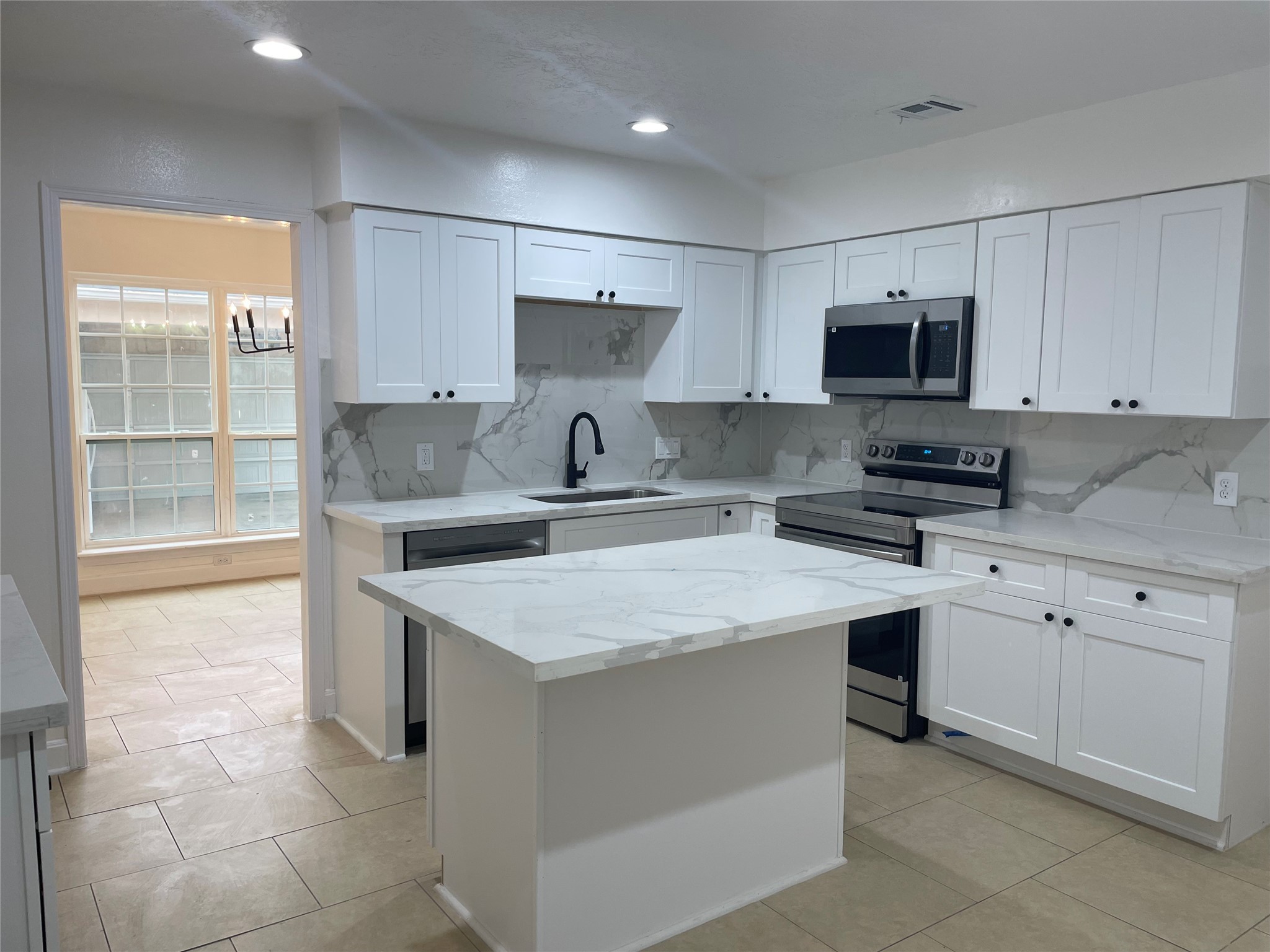 11630 Coachfield Lane Houston, TX 77035 - Photo 6 of 18 a kitchen with stainless steel appliances granite countertop a sink stove and refrigerator